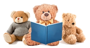 A teddy bear reads a story to two smaller bears